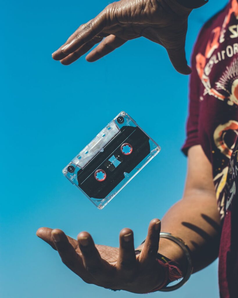 person doing tricks on cassette tape