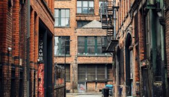 photo of street surrounded by buildings