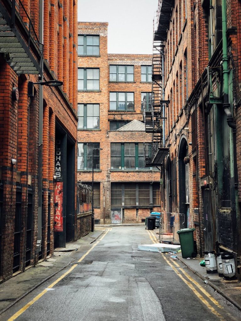 photo of street surrounded by buildings