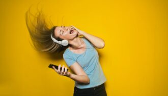 photography of woman listening to music