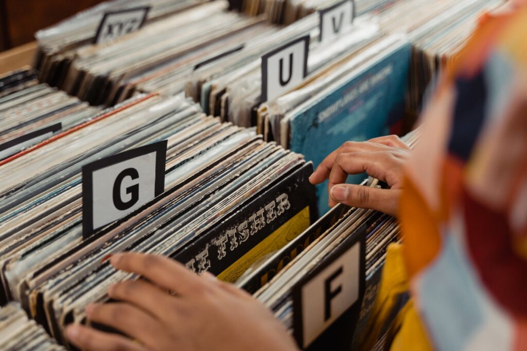 woman choosing vinyl record